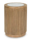 The Ashley Camdill End Table T808-6 features a cylindrical wooden base with vertical grooves and a round faux Carrara marble top, making it an elegant addition to any contemporary living room.