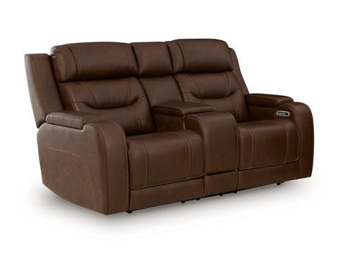 The Ashley Knightington Brown Power Reclining Loveseat (U1160218A) features plush cushions, wide armrests, and a center console with cup holders—making it the ideal home theater sofa for ultimate comfort and style.