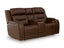 The Ashley Knightington Brown Power Reclining Loveseat (U1160218A) features plush cushions, wide armrests, and a center console with cup holders—making it the ideal home theater sofa for ultimate comfort and style.