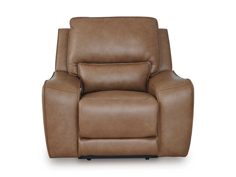 The DeepWakes Caramel Recliner U6260613 by Ashley is a brown leather armchair with plush cushions and wide armrests, expertly crafted from top-grain leather and shown from the front against a plain white background.