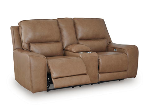 The DeepWakes Caramel Power Reclining Loveseat (Ashley, model U6260618) features two top-grain leather seats in a rich brown caramel finish, a central armrest with built-in cup holders, and extended footrests on both sides.
