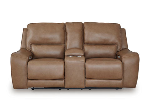 The Ashley DeepWakes Caramel Power Reclining Loveseat (model U6260618) features two top-grain leather seats separated by a center console with dual cup holders, plus padded armrests and cushioned backs for exceptional style and comfort.