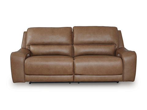 The Ashley DeepWakes Caramel Power Reclining Sofa U6260647 features top-grain leather upholstery in a rich caramel tone, wide armrests, plush cushioned seats, and a modern design, shown from the front against a white background.