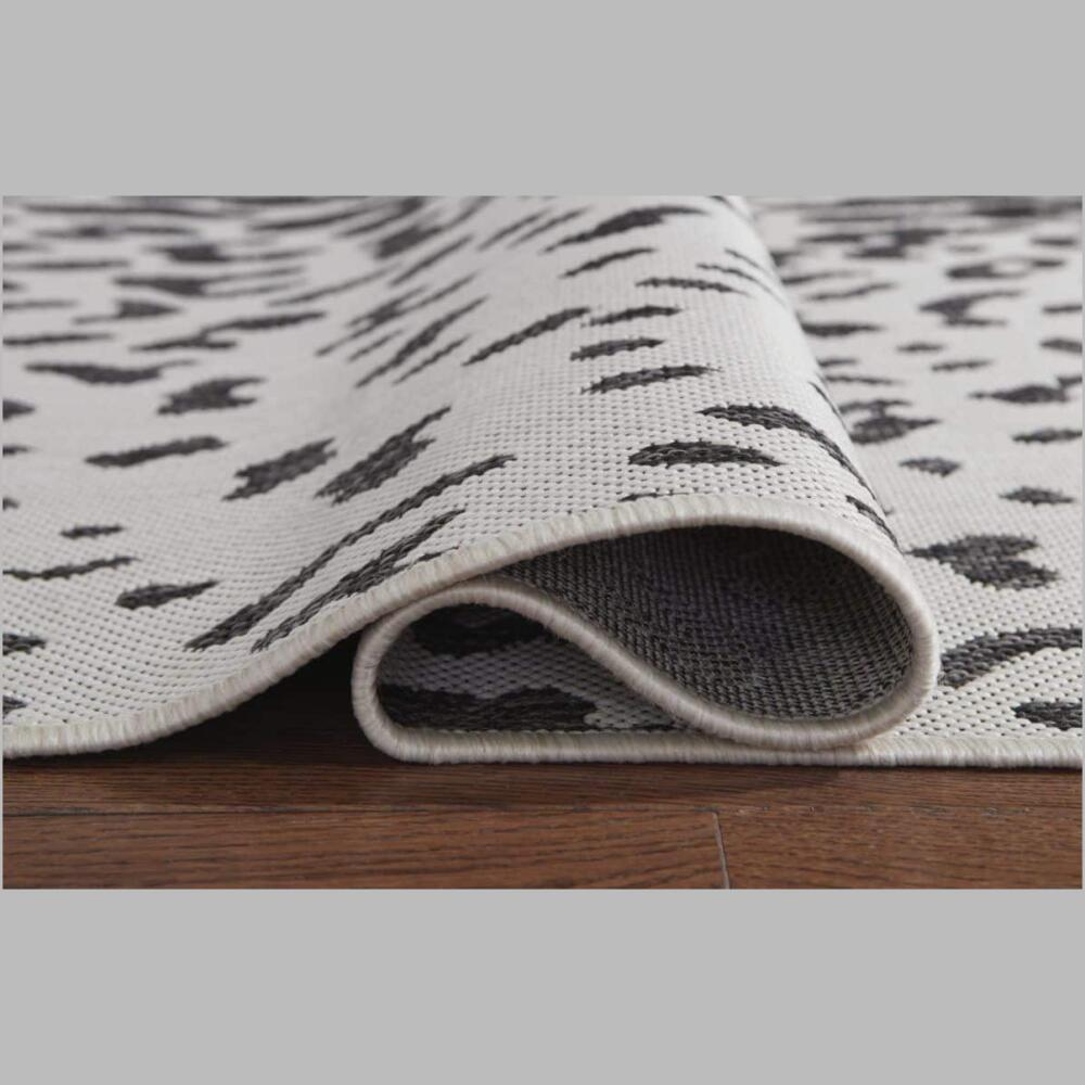 rug backing for r405021 samya rug go wild with this indoor/outdoor animal print rug, thanks to its black, white and gray color palette.