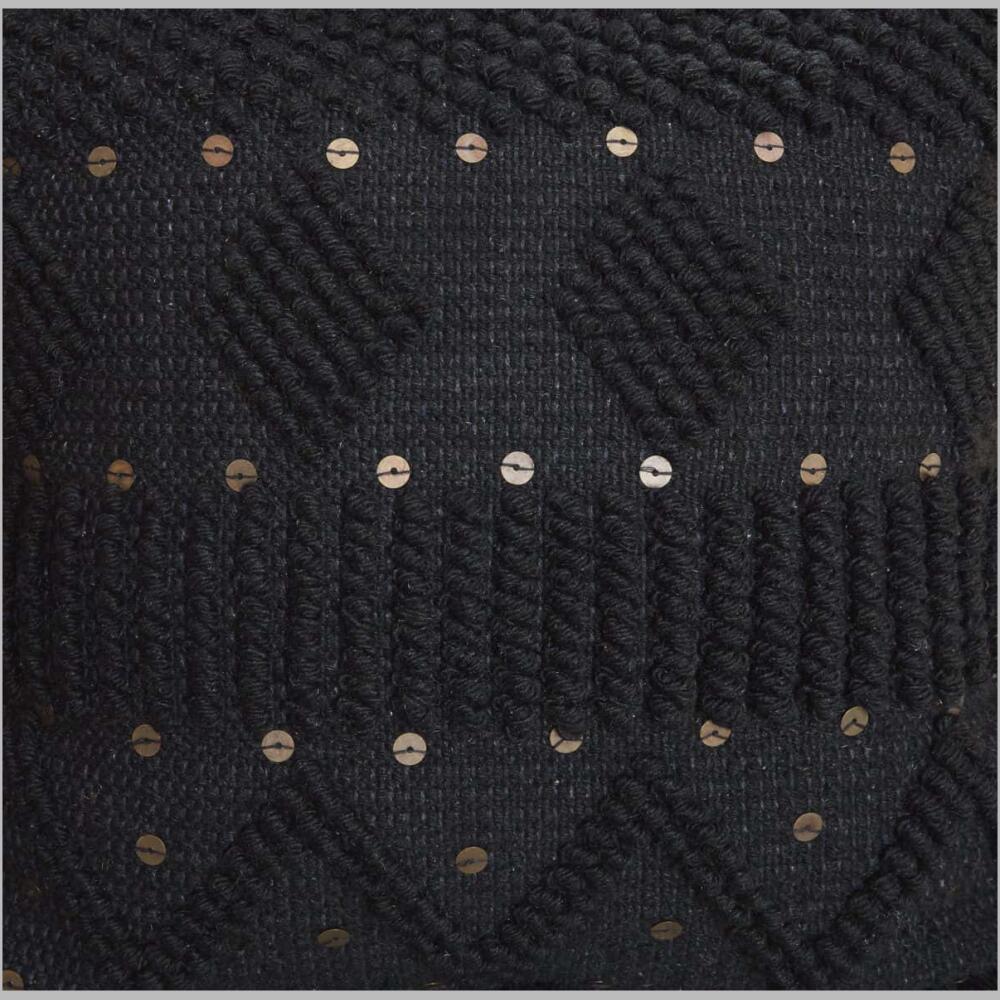 a1000934 mordechai pillow up-close view of a textured black ground is highlighted with goldtone accents and tassels on each corner of the pillow.